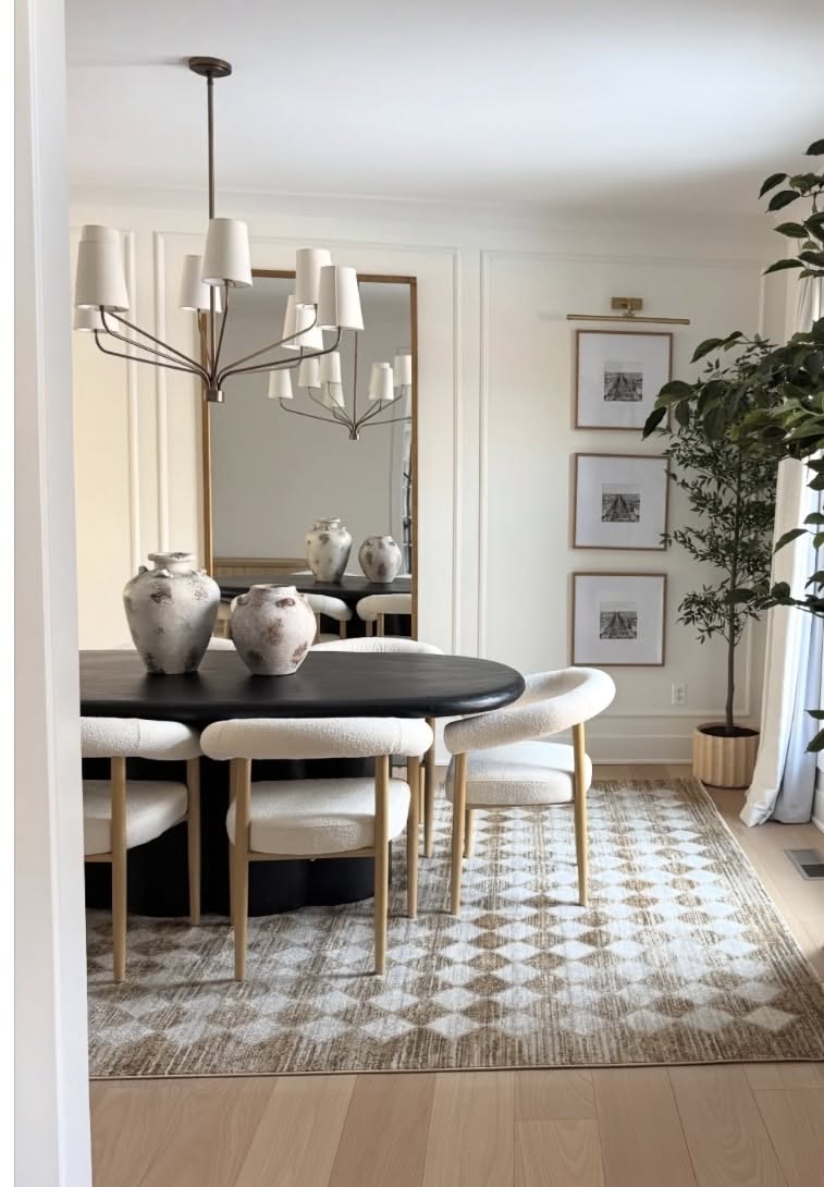 Modern Dining Room with Black Oval Table and Neutral Accents