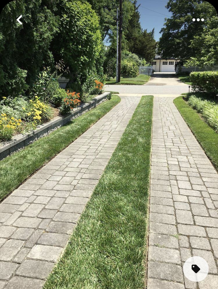 Eco-Friendly Driveway with Grass Strips and Concrete Pavers